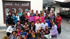 A group photo of the Nepal Campus Church outside the rented house that they use as a worship centre.
